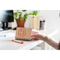 Notatnik ok. B7 "uśmiechnięta buzia" z długopisem z logo firmy w LazyStore!